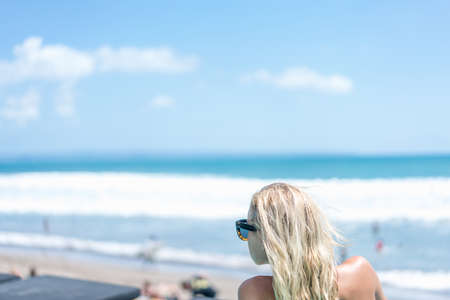 beautiful young sexy woman girl at sea sunbathingの写真素材