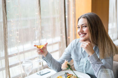 Beautiful woman at the reastaurantの写真素材