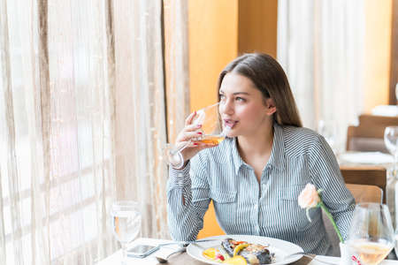 Beautiful woman at the reastaurantの写真素材
