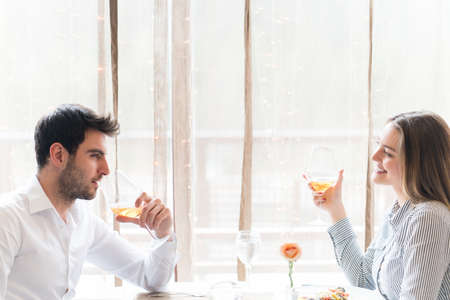 food, christmas, holidays and people concept - smiling couple eating main course at restaurant