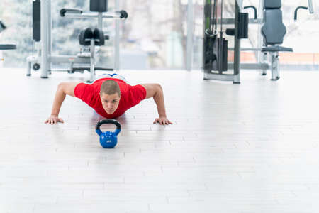 Woman Kettlebell training in gymの写真素材