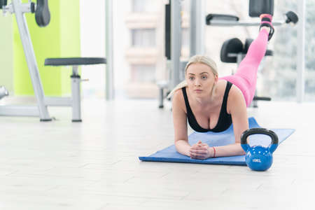 Woman Kettlebell training in gymの写真素材