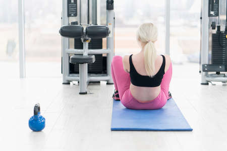 Woman Kettlebell training in gymの写真素材