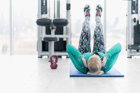 Woman Kettlebell training in gym