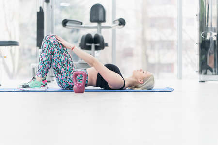 Woman Kettlebell training in gym