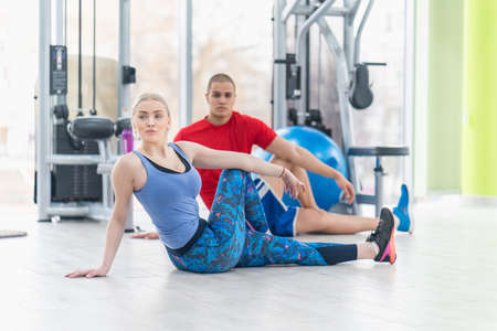 Fitness couple in the gym workoutの写真素材