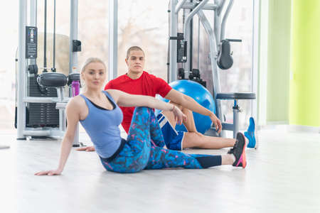 Fitness couple in the gym workoutの写真素材