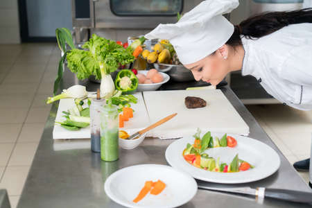 Chef Cooking, Cutting and preparing next plate