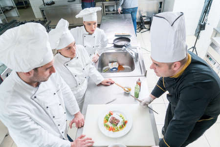 Chef Cooking, Cutting and preparing next plate