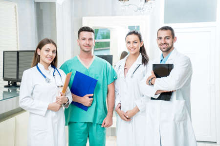 Group of medical staff smiling at the hospitalの写真素材