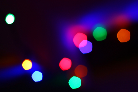 Colorful Red, Yellow and Green Christmas Tree Bokeh background of de focused glittering lightsの写真素材