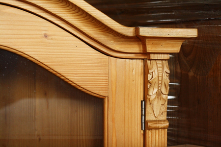 Antique cupboard made of spruce wood with glass doorの写真素材