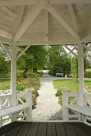 Peaceful gazebo set in the spring garden parkの写真素材