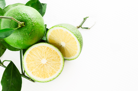 kind of orange , citrus on white background. it has a green color but sweet tasteの写真素材