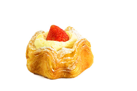 croissant topping with cream and strawberry on white backgroundの写真素材