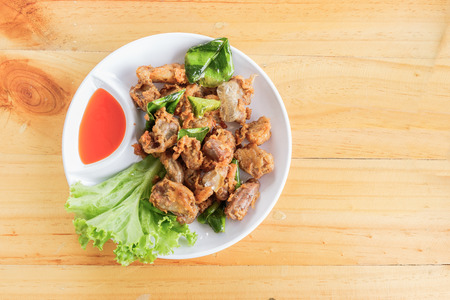 top view of food made with animal entrails put on wood tableの写真素材