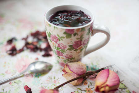 mug with red tea is on the tableの写真素材