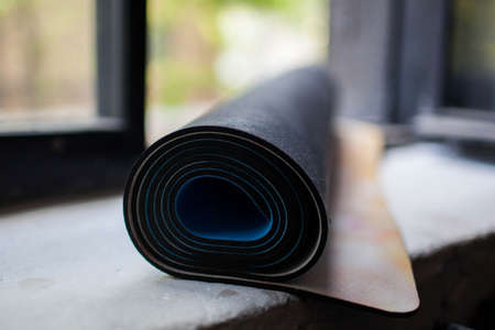 a rolled up yoga Mat