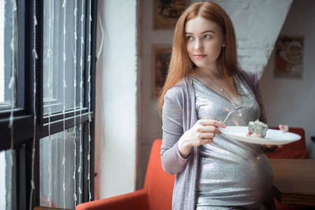 pregnant woman with cake