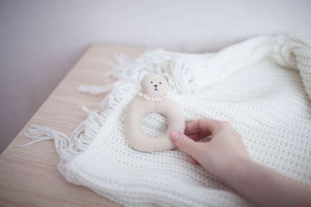 Soft rattle is handmade on white background