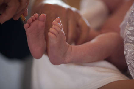 Feet of baby close up. Childish legs on blurred background.の写真素材