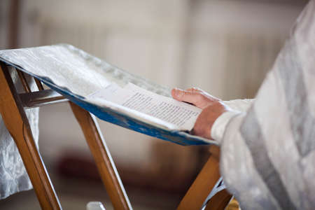 Orthodox priest reads a prayer