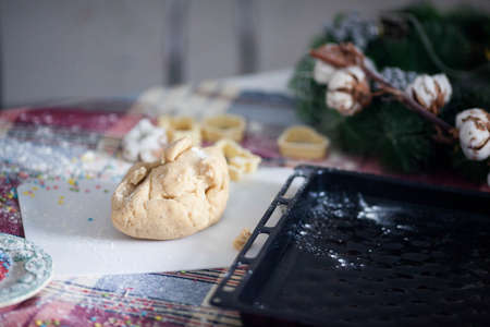 The piece of dough lying on the table for cookingの写真素材
