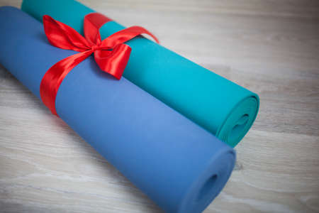 Two colored yoga Mat with a gift ribbon