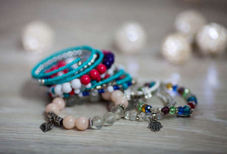 Colorful bracelets are handmade on a light backgroundの写真素材