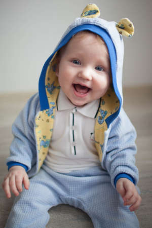 sweet baby on a white background in a blue outfitの写真素材