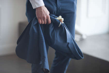 Groom in Blue Suit with a White Rose Boutonniereの写真素材