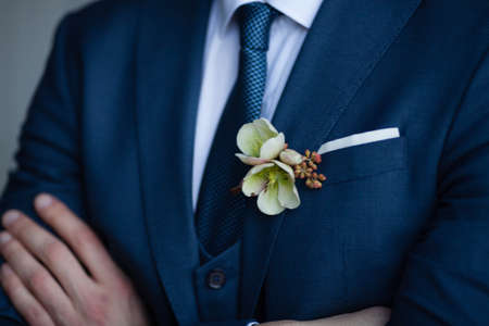Groom in Blue Suit with a White Rose Boutonniereの写真素材