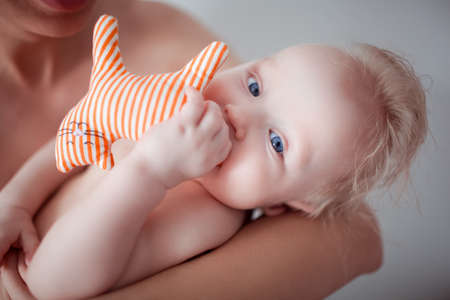 Portrait Of Father Holding Newborn Baby At Homeの写真素材