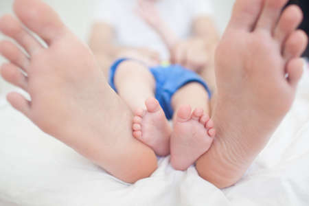 Father and son lying on the bed.の写真素材