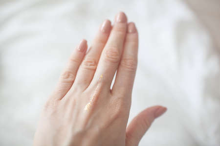 On the female hand flash stickerの写真素材