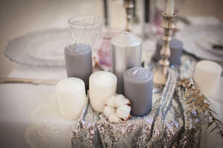 The white interior of the room with a candle and handmade cottonの写真素材