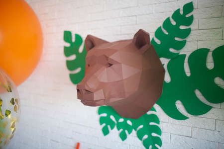 polygonal head of a bear hanging on the wallの写真素材