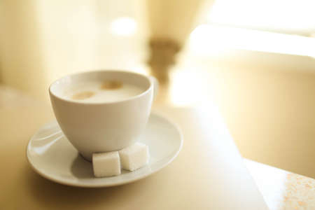 Cup of cappuccino on the table, coffee shop background. Marble textureの写真素材
