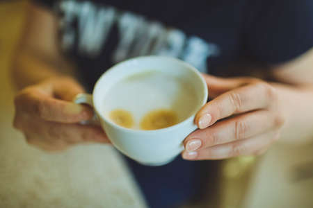 Cup of cappuccino on the table, coffee shop background. Marble textureの写真素材
