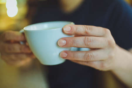 Cup of cappuccino on the table, coffee shop background. Marble textureの写真素材