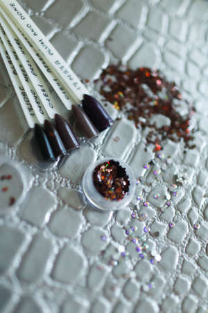 Red shades of shellac, for a covering of nails after manicure