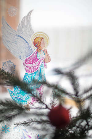 Christmas sticker on the window angelの写真素材