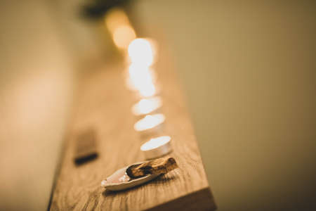 Incense made of wood is burning in the room. Close up.の写真素材