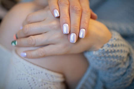 Beautiful manicure shiny glitter silver color. Winter.の写真素材