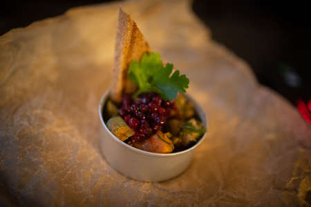 Original vegetarian dish of baked vegetables and cranberries.