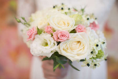 Delicate wedding bouquet of white and pink roses.Delicate wedding bouquet of white and pink roses. Close upの写真素材