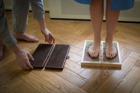 The yogis feet are on nails. Healthy lifestyle.の写真素材