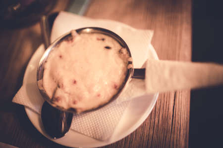 Julienne with cheese and mushrooms in a metal dish. Close up.の写真素材