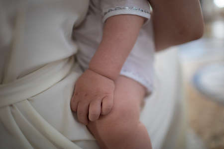 Family Baby Hands. Father and Mother Holding Newborn Kid. Child Hand Closeup into Parents. Close up.の写真素材