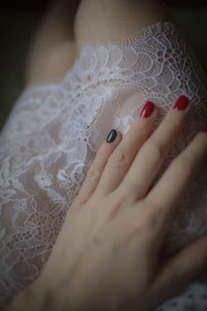 Beautiful large white lace on the nightgown. Close up.の写真素材